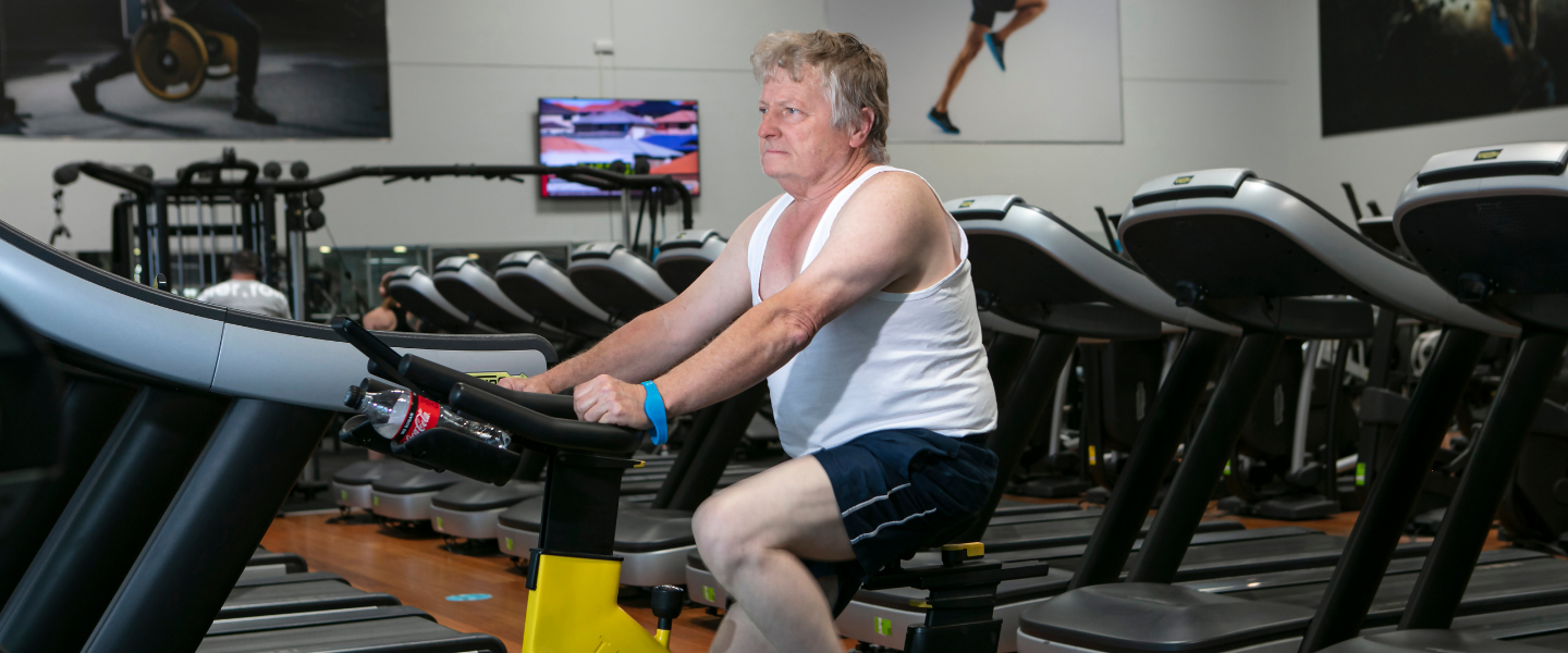 Man using cycle equipment in main gym